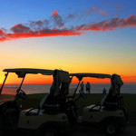 Golfers on Makai Golf Course 7th hole at sunset