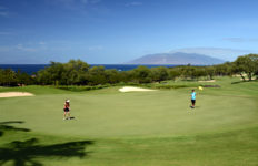 Wailea Gold Course Hole 5 on Maui with coastline and Molokini in the background
