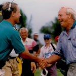 Mark Rolfing and Arnold Palmer shake hands
